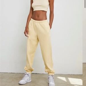 TNA Aritzia CozyAF Fleece Sweatpants in Light Yellow
